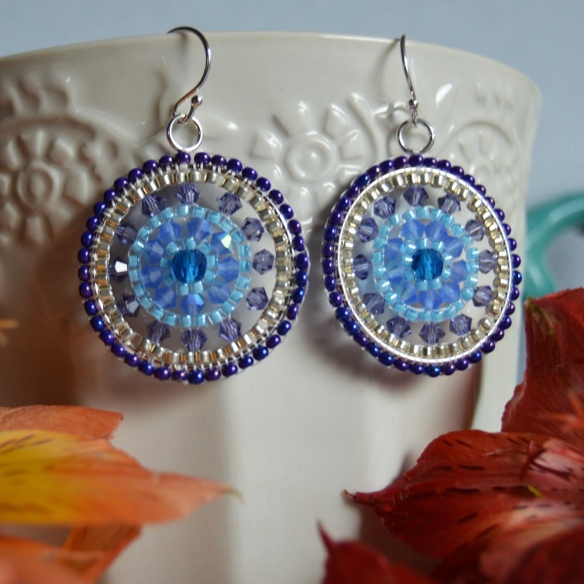 Woven Czech glass earrings in blue tones.