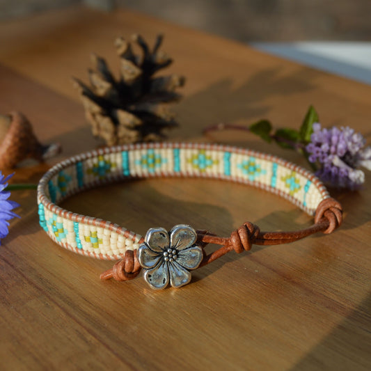 Leather wrap seed beads bracelet in green & blue tones.