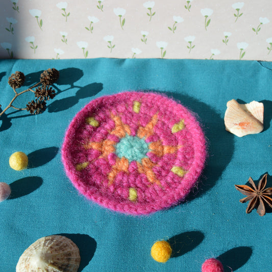 Handcrafted colourful wool coaster.